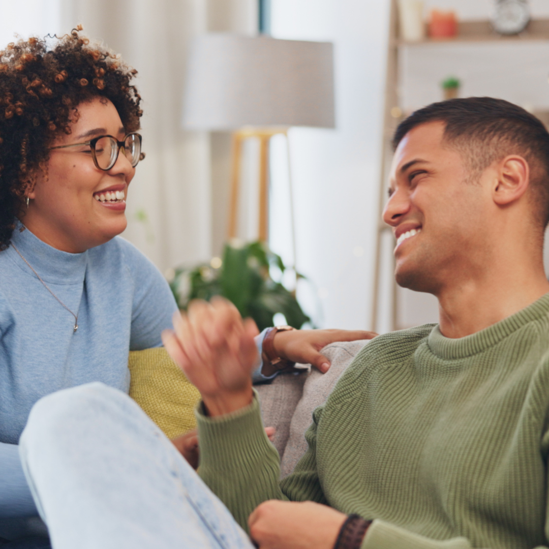 2 people talking pride sofa